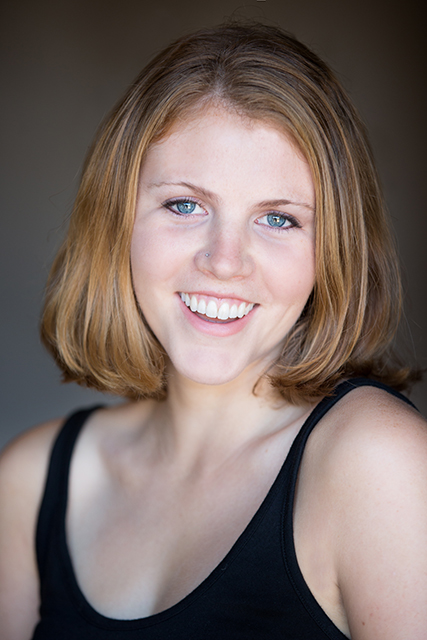 A portrait of a young woman smiling 