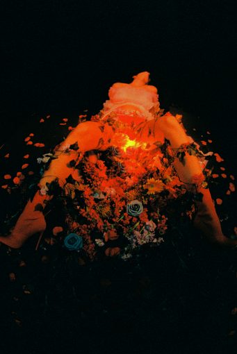 Read more about the article WE HOPE YOU BROUGHT FLOWERS: AN INTERVIEW WITH EMELINE